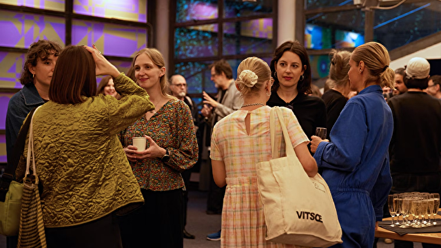 group of people at an event visiting with each other